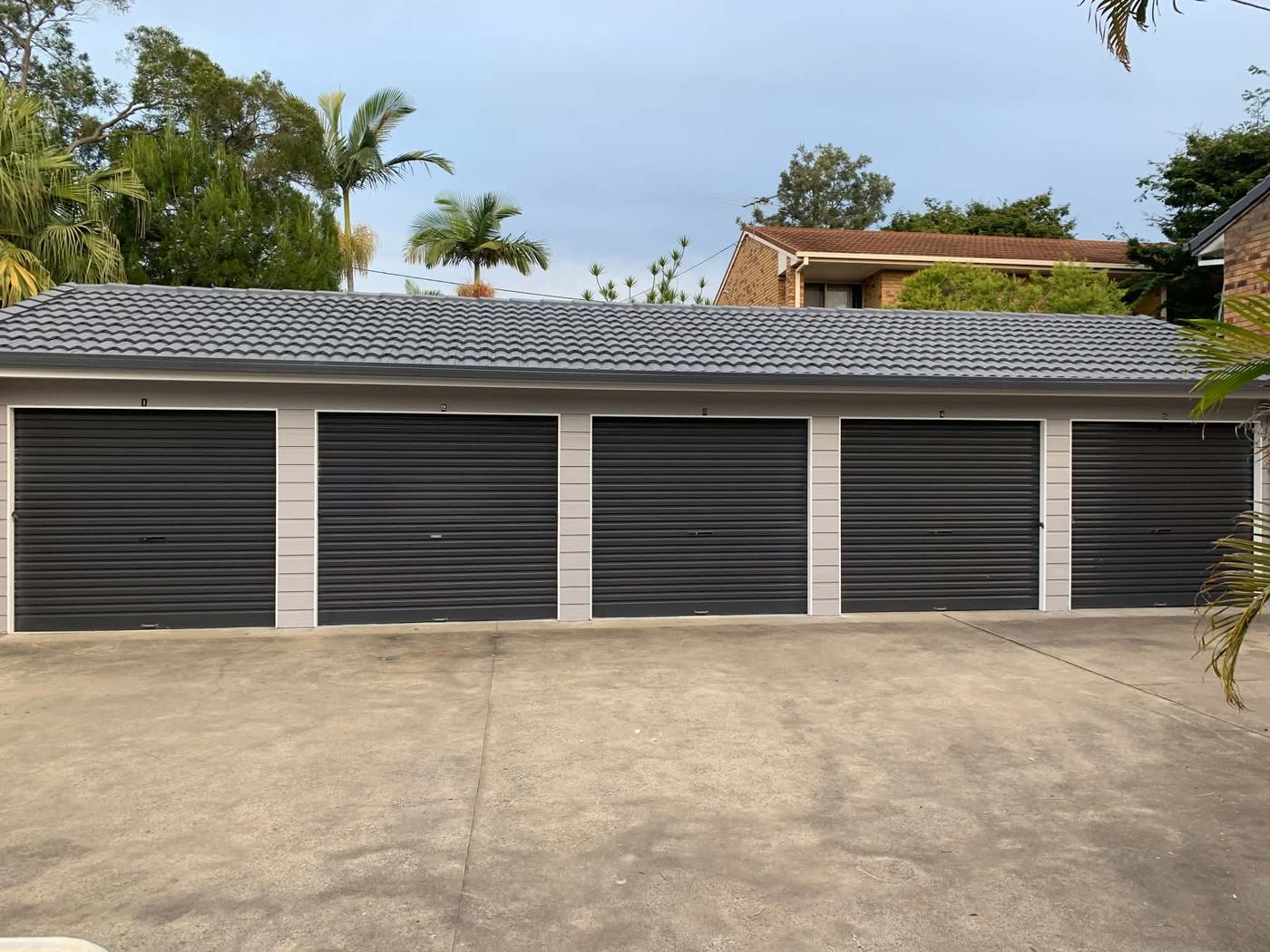 Strata garage doors repainted charcoal grey