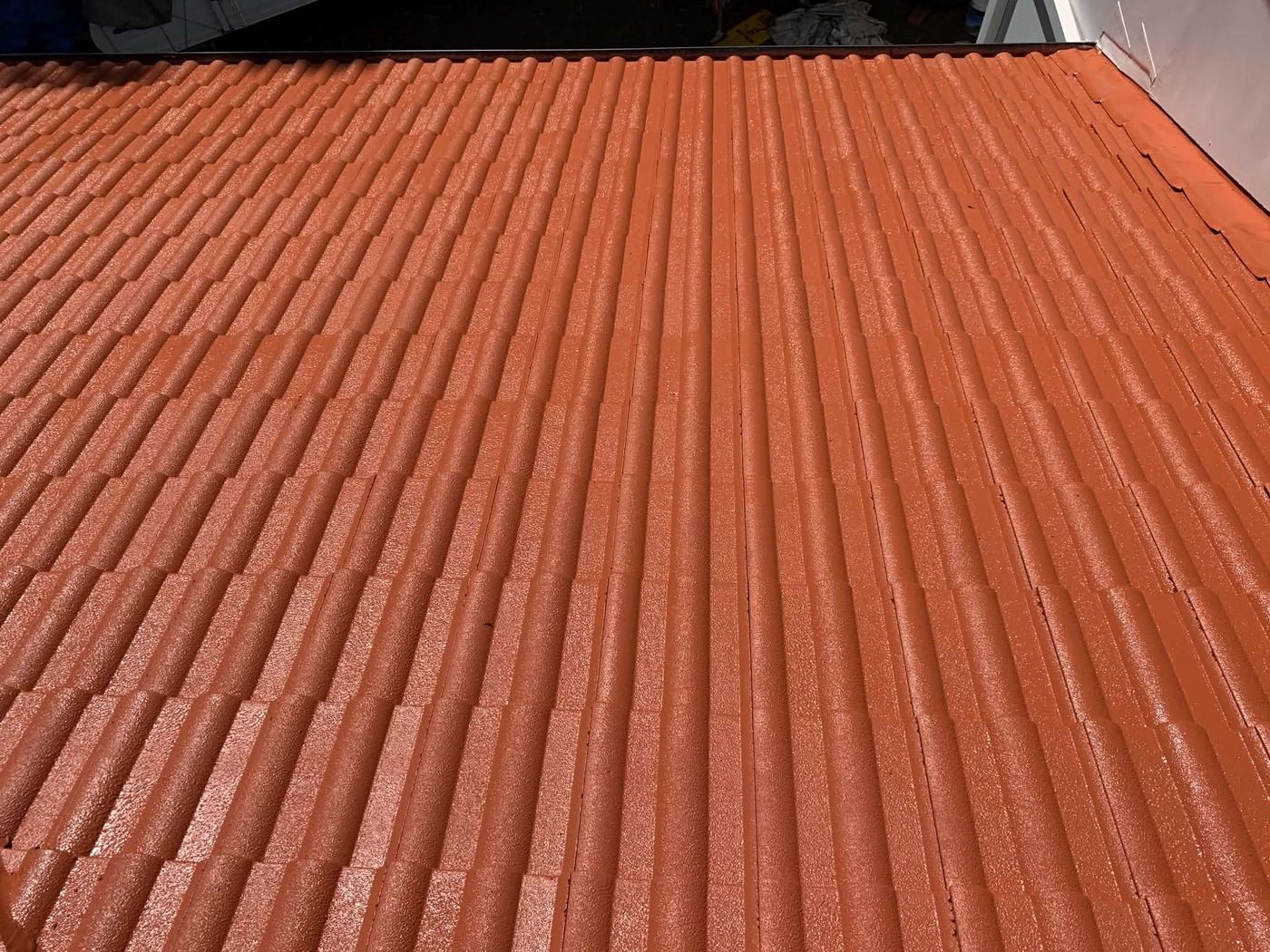 Tile roof restored to a vibrant terracotta finish