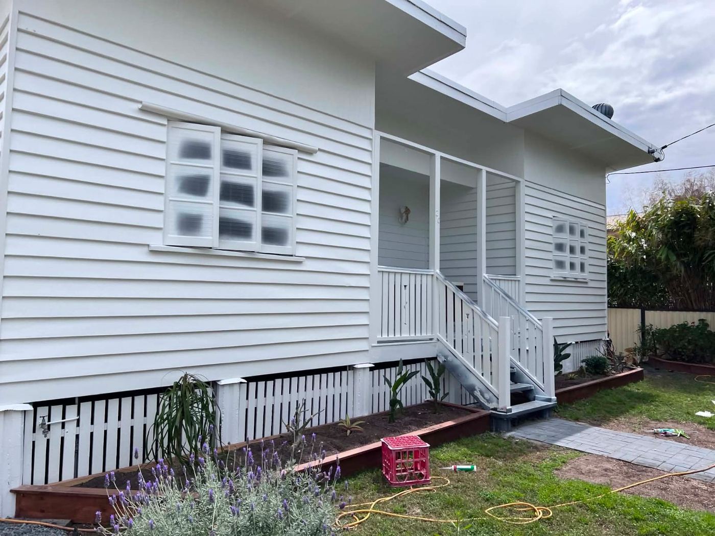 Weatherboard home freshly repainted white