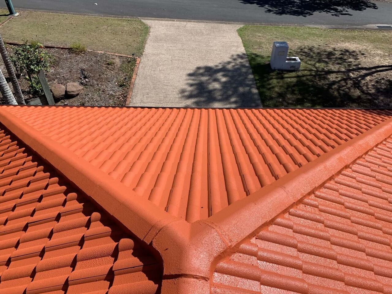 Newly restored terracotta roof ridge in Brisbane
