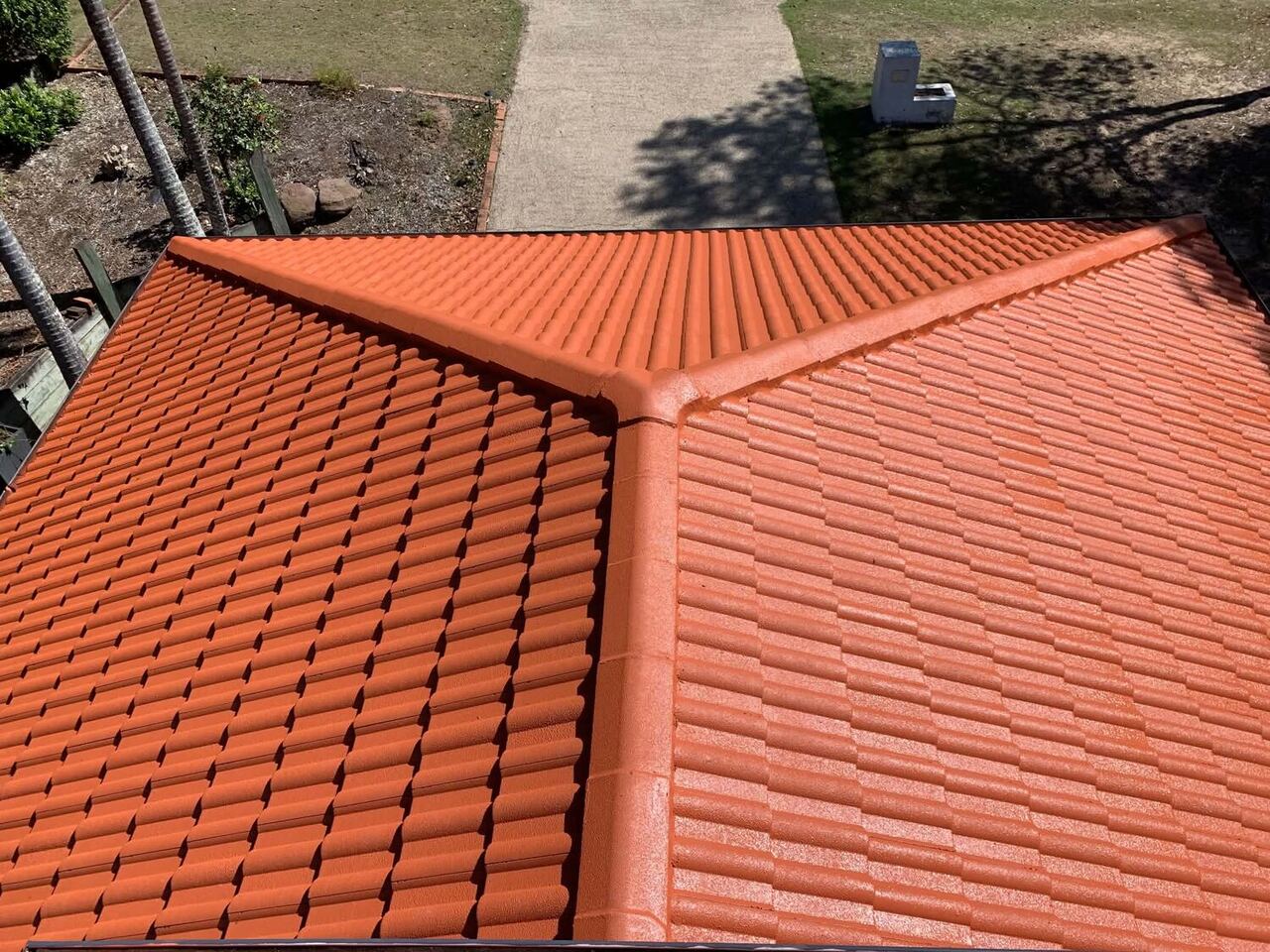 Restored terracotta hip roof on a Brisbane home