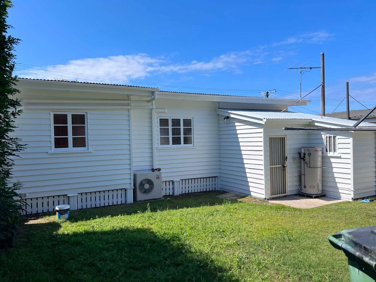 Repainted white weatherboard home exterior in Brisbane