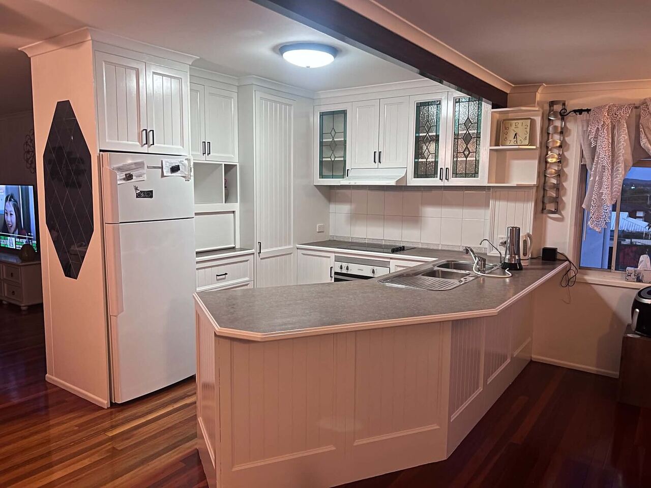 Freshly painted white kitchen cabinetry in a Brisbane home