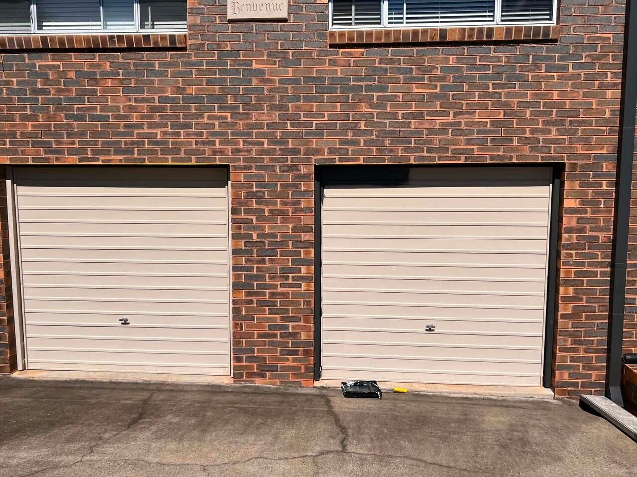 Repainted brick garage block with a fresh door colour in Brisbane